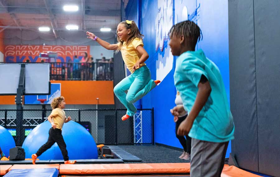 kids bouncing on trampolines at sky zone park lakeland