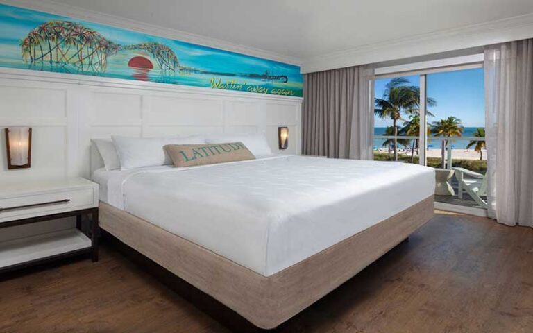 king size bed suite with balcony at margaritaville beach house key west