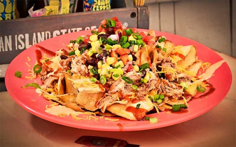 loaded nachos on red plate at long doggers cocoa beach