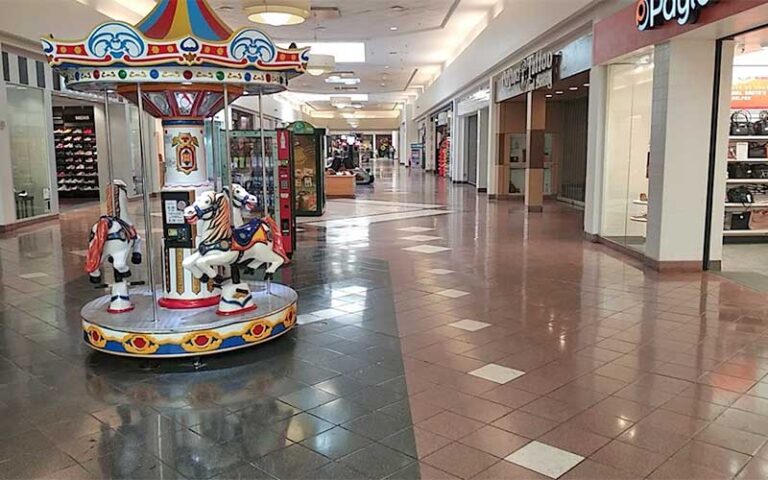 mall hallway with carnival kids rides at merritt square mall space coast