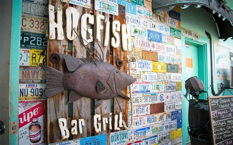 metal sculpture of fish sign at hogfish bar grill key west