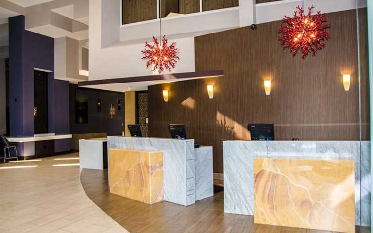 modern style lobby with front desk at hilton cocoa beach oceanfront