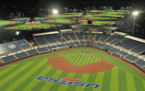 night aerial view of lighted baseball fields and stands at usssa space coast complex melbourne