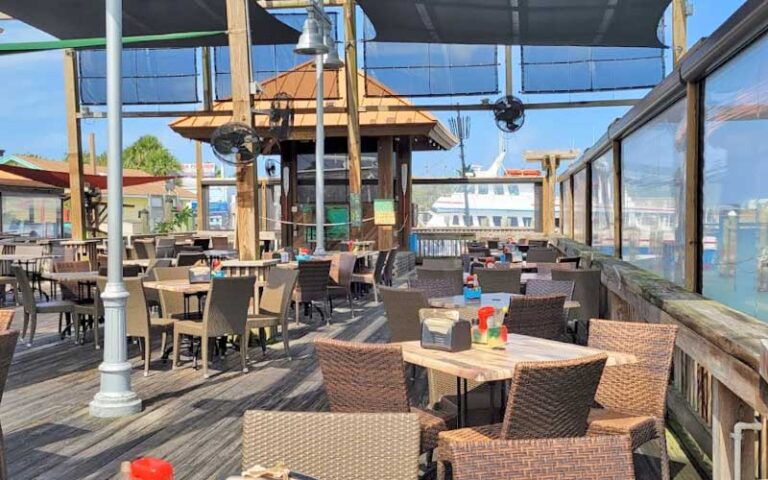 outdoor patio dining on dock at rustys seafood oyster bar cape canaveral