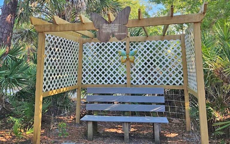 park bench and arbor in butterfly garden at erna nixon park west melbourne