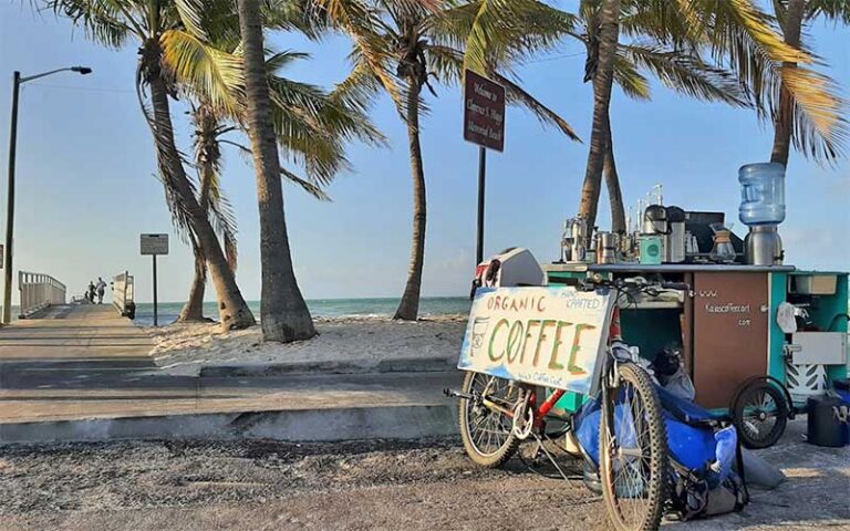 park entrance with beach pier and coffee cart vendor with bike at clarence s higgs memorial beach key west