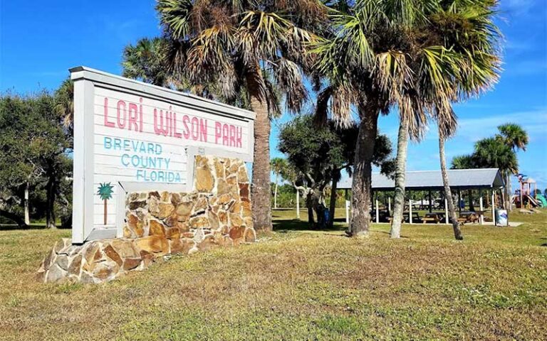 park sign with pavilions and playground at lori wilson park cocoa beach