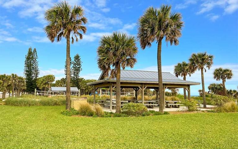 picnic pavilions and volleyball court with palms at pelican beach park satellite beach