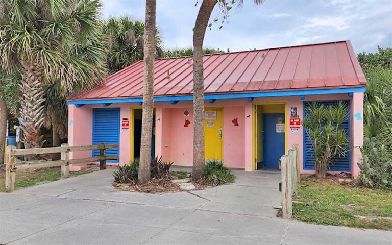 pink and red restroom facilities building at canova beach park indialantic