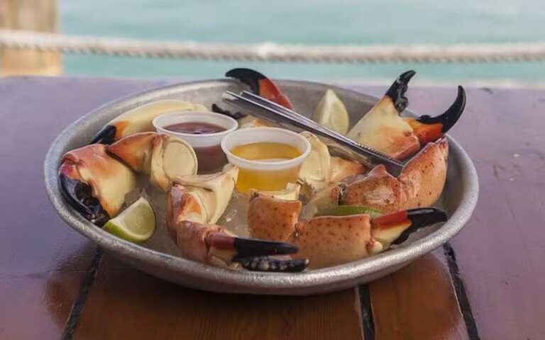 platter of crab claws with dips at half shell raw bar key west