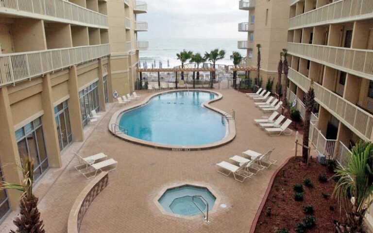 pool area courtyard with ocean access at crown plaza melbourne oceanfront