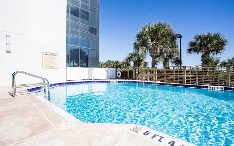 pool area next to high rise at hilton cocoa beach oceanfront