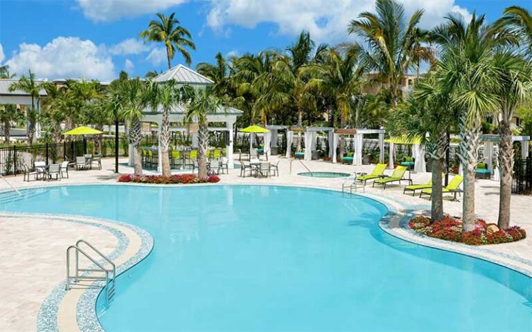 pool area with arbors cabanas and loungers at hilton garden inn key west