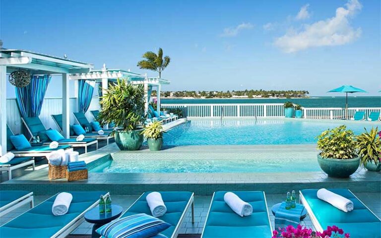 pool deck overlooking ocean with cabanas at ocean key resort spa key west