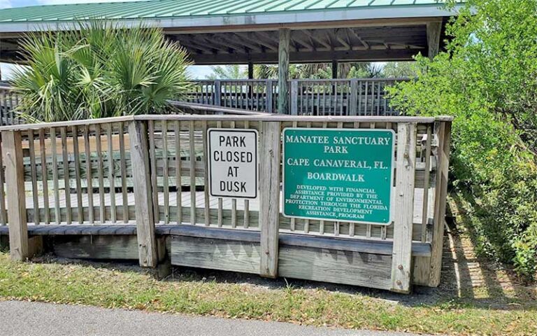 ramp to boardwalk with park signs at manatee sanctuary park cape canaveral