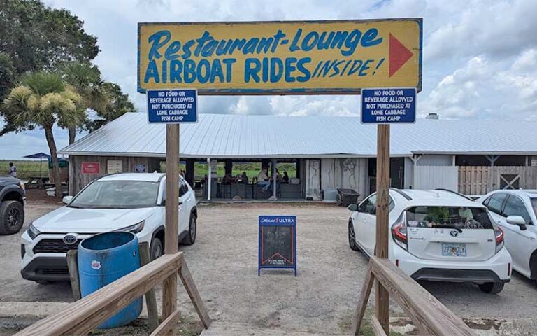 restaurant sign with parking and outdoor patio at lone cabbage fish camp cocoa