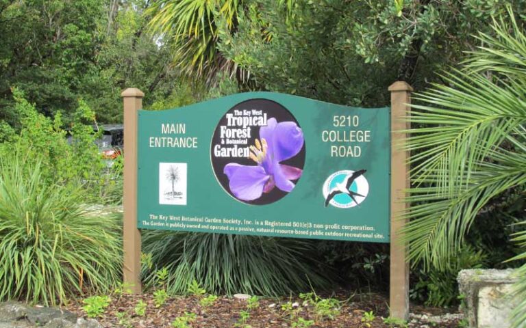 roadside sign for entrance with trees at key west tropical forest botanical garden