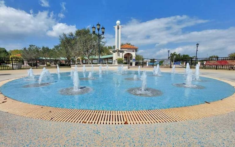 round splash pad with benches at cocoa riverfront park