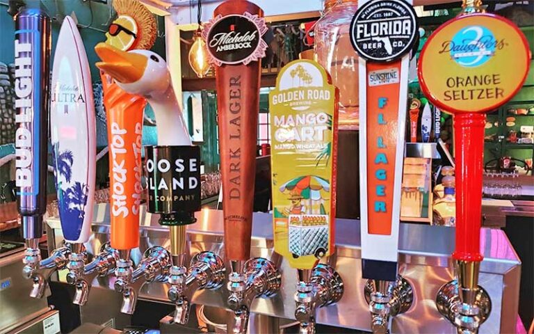 row of beer taps along bar at cocoa beach fish camp