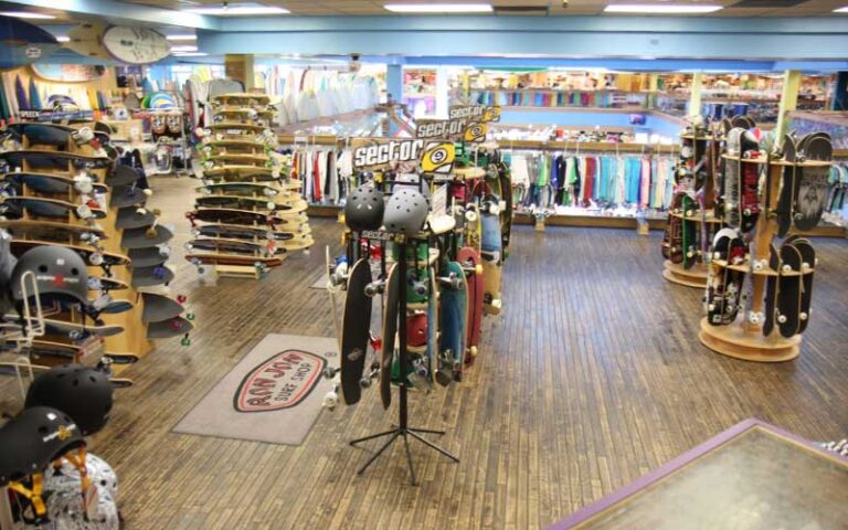 skateboards on racks and shelves in shop at ron jon surf shop cocoa beach