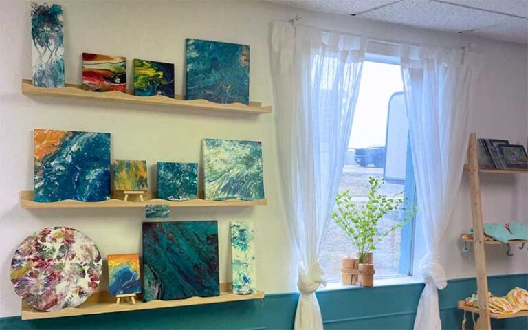 store wall with paintings and window at pelican cove gifts souvenirs cocoa beach