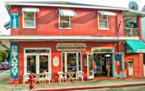 street view of two story magenta colored restaurant at harpoon harrys key west