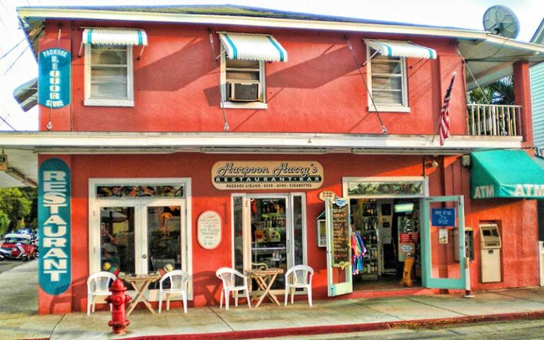 street view of two story magenta colored restaurant at harpoon harrys key west