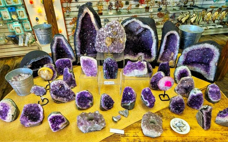 table with many purple quartz stones at the key west shell warehouse