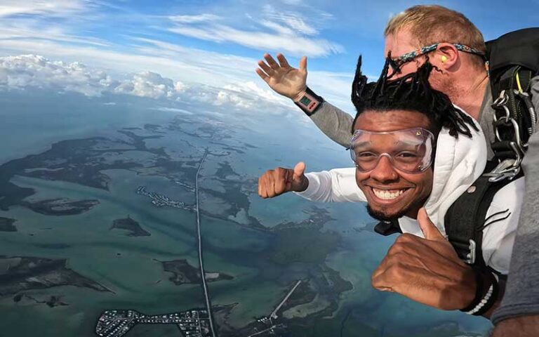 tandem skydiver smiling with sky at skydive key west