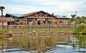 view from river of restaurant with outdoor bar area at grills riverside seafood deck tiki bar melbourne