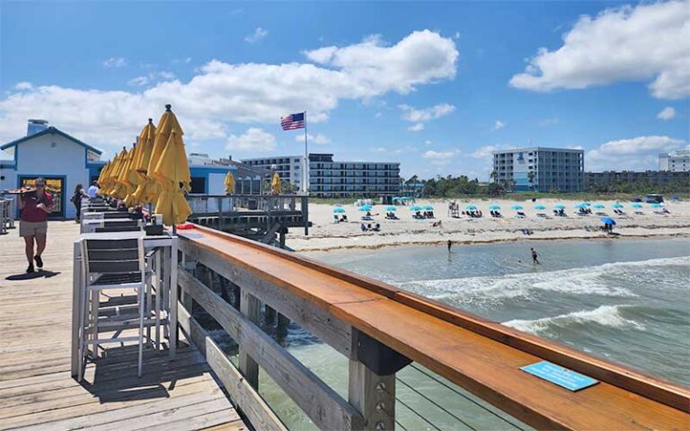 view of beach from pier with server at cocoa beach space coast