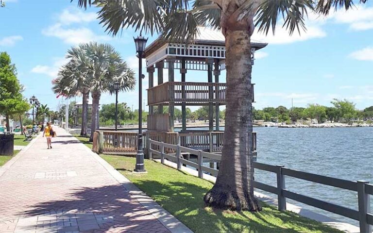 waterfront paved walkway with pagoda structure at cocoa riverfront park