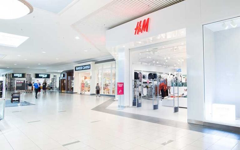 well lighted mall interior with hm store at melbourne square space coast