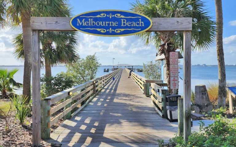 wooden gateway at start of pier at melbourne beach pier space coast