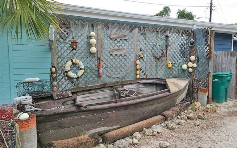 boat and nautical display behind museum building at anna maria island historical society