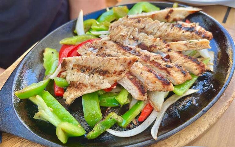 chicken fajita platter on patio table at wicked cantina bradenton beach anna maria island