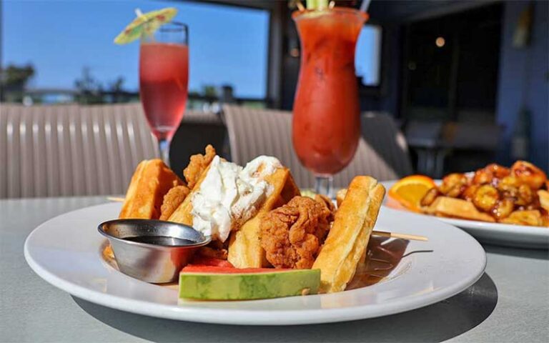 chicken and waffles with drinks at daiquiri deck anna maria island