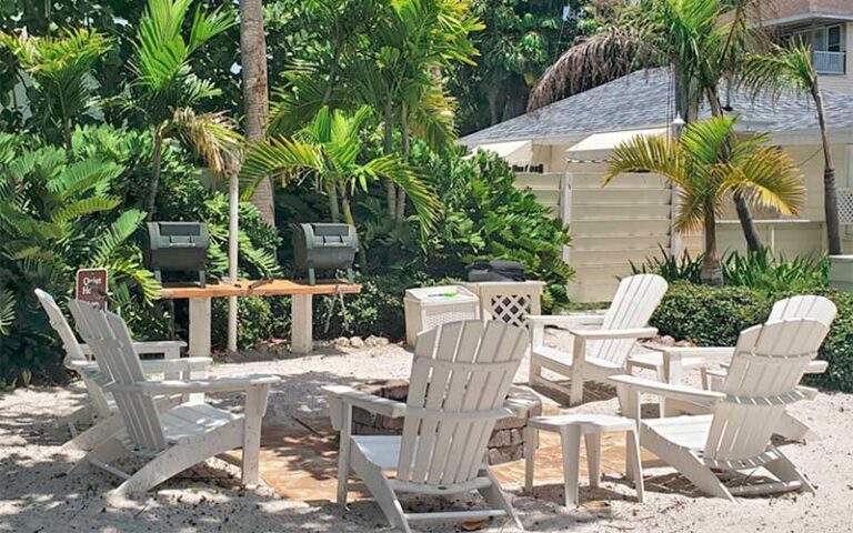 courtyard patio with chairs and grills at bungalow beach resort bradenton anna maria island