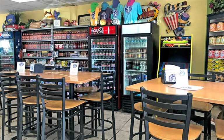 dining area with bar tables and beverage coolers at two scoops anna maria island