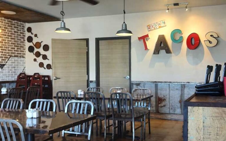 dining interior with tacos sign at wicked cantina bradenton beach anna maria island