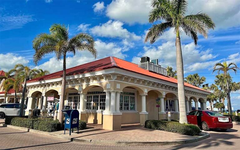 exterior of building with palms and ocean view at two scoops anna maria island