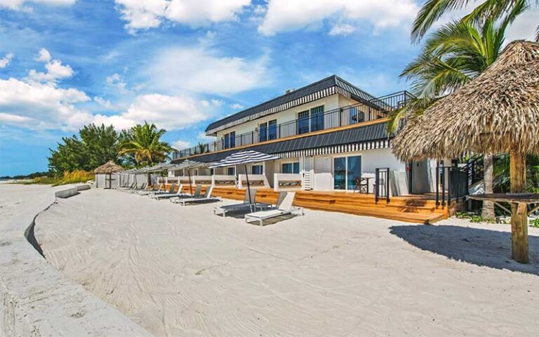 exterior of resort building with deck on sand at anna maria island inn bradenton beach