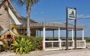 exterior of restaurant with ocean and sign at the waterfront restaurant anna maria island