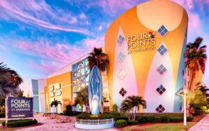 front exterior of hotel with twilight sky at four points by sheraton cocoa beach