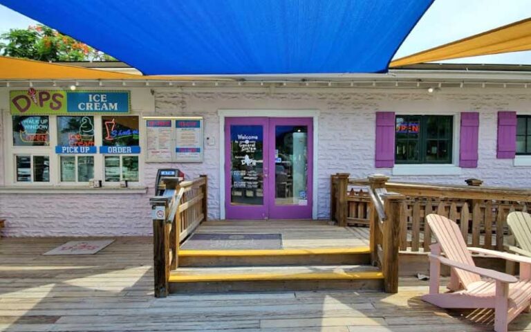 front exterior with patio and sun shades at anna maria general store