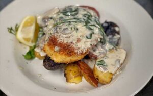 herb encrusted halibut entree at hurricane hanks holmes beach anna maria island