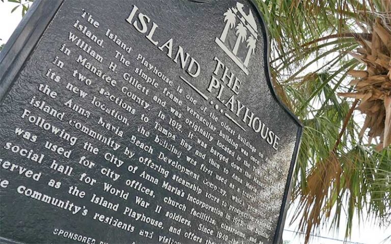 historic marker sign with palms at the island players anna maria