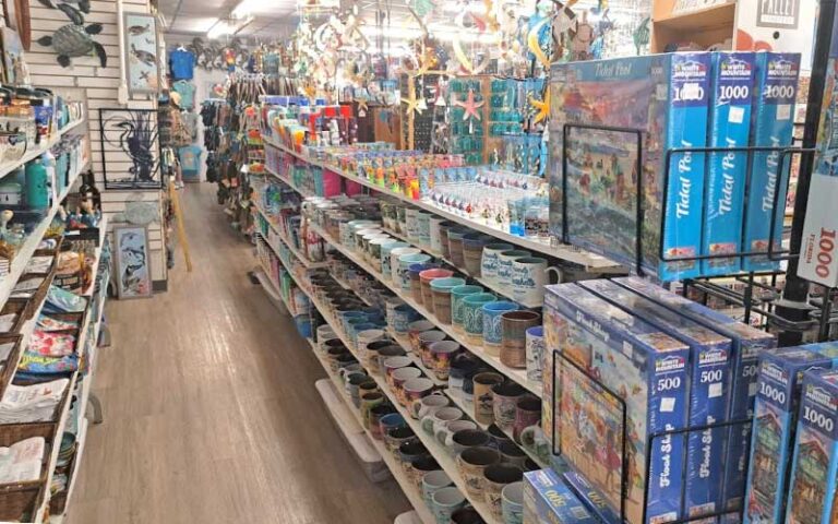 interior store shelves with mugs and puzzles at green turtle shell gift shop bradenton beach