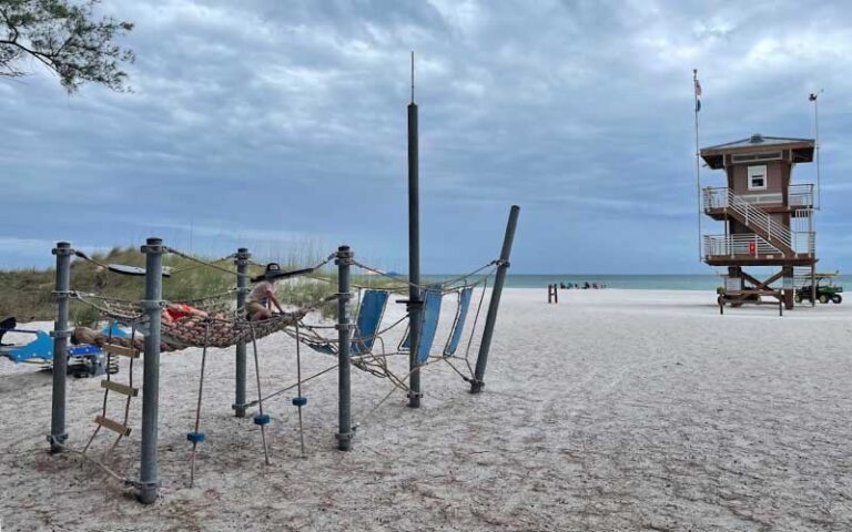 kids climbing on playground with lifeguard tower at coquina beach bradenton anna maria island