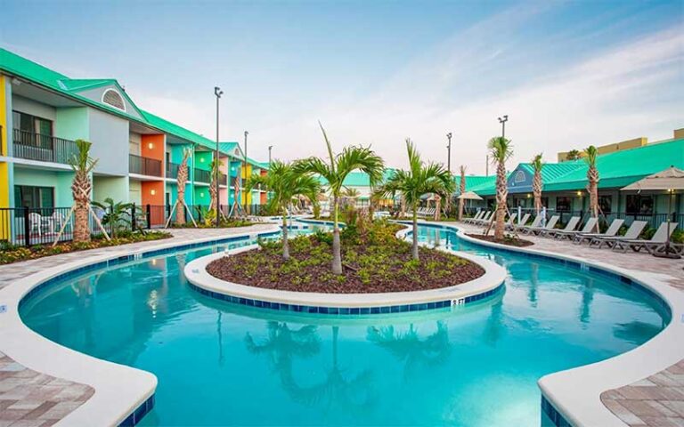 lazy river with resort rooms along sides at beachside hotel suites cocoa beach